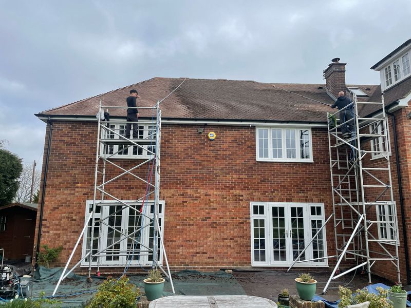 Roof cleaning carried out safely from scaffold towers by The Roof Moss Cleaners in Billingshurst
